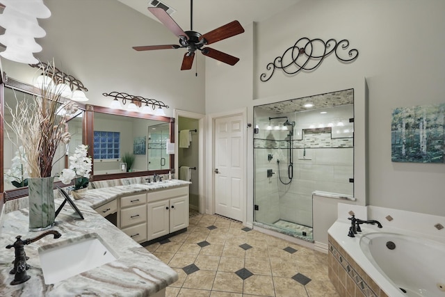 full bath with ceiling fan, a garden tub, a stall shower, vanity, and tile patterned flooring
