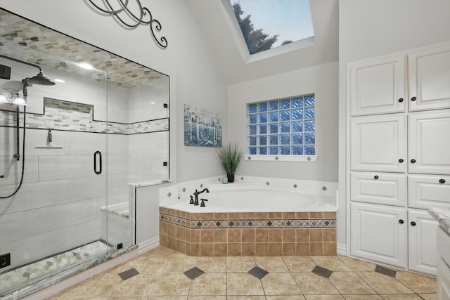 full bathroom featuring a bath, a towering ceiling, tile patterned floors, and a shower stall