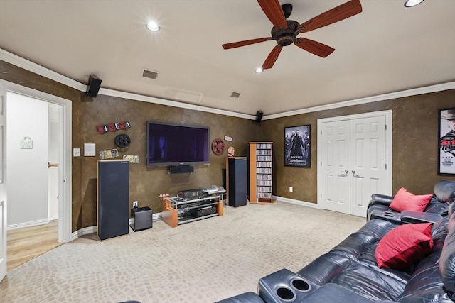 living room with a ceiling fan, recessed lighting, baseboards, ornamental molding, and light carpet