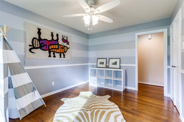 6918 Blackwood Dr, Dallas, TX 75231 - bedroom with wood finished floors, ceiling fan, and baseboards
