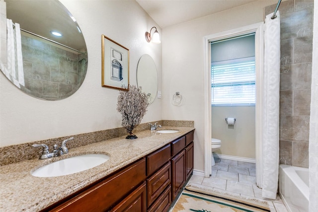 6918 Blackwood Dr, Dallas, TX 75231 - bathroom with toilet, double vanity, tile patterned flooring, and shower / bath combo