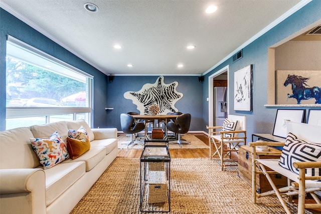 6918 Blackwood Dr, Dallas, TX 75231 - living area featuring crown molding, light wood-type flooring, and recessed lighting