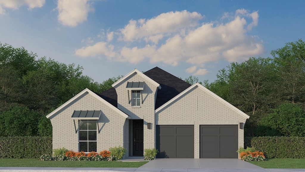 view of front facade featuring a garage, driveway, and brick siding