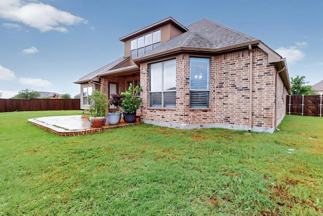 4018 Bear Creek Ct, Celina, TX 75078 - rear view of house with brick siding and a patio area