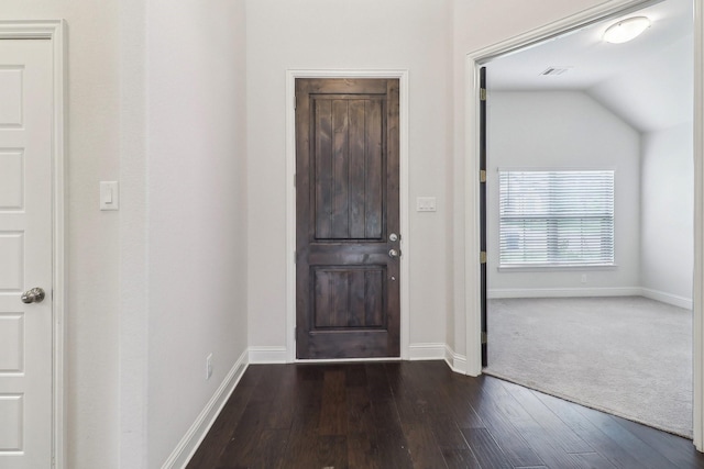 entrance foyer with wood finished floors, baseboards, and vaulted ceiling
