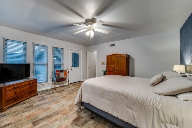 2715 Peach Tree Dr, Carrollton, TX 75006 - bedroom with light wood-style flooring and a ceiling fan