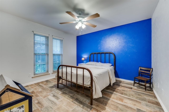 2715 Peach Tree Dr, Carrollton, TX 75006 - bedroom featuring wood finished floors, baseboards, and a ceiling fan