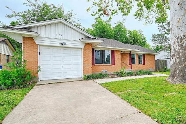 view of front facade featuring driveway, board and batten siding, brick siding, an attached garage, and a front yard