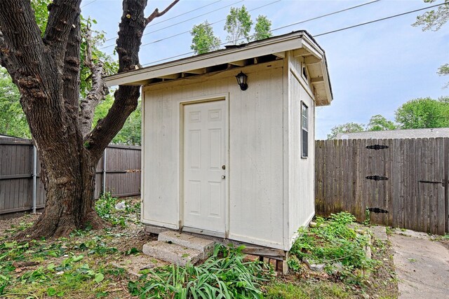 view of shed with a fenced backyard