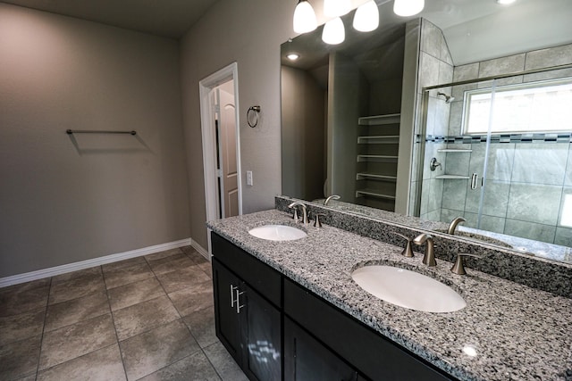 504 Lakeway Ln, Justin, TX 76247 - bathroom featuring baseboards, a shower stall, double vanity, and tile patterned floors