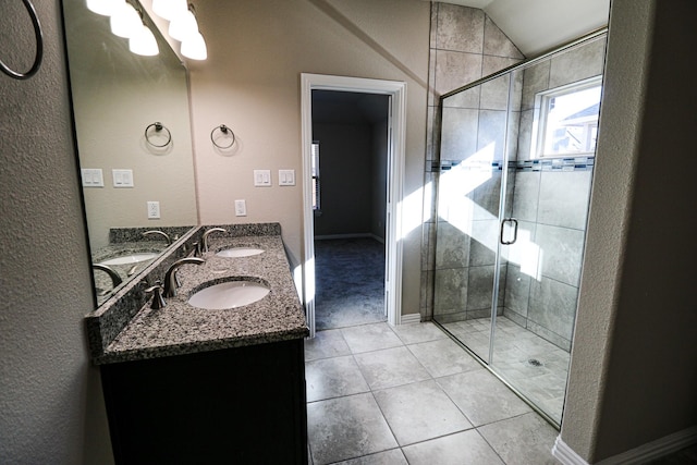504 Lakeway Ln, Justin, TX 76247 - full bath featuring a shower stall, a chandelier, double vanity, tile patterned flooring, and a textured wall