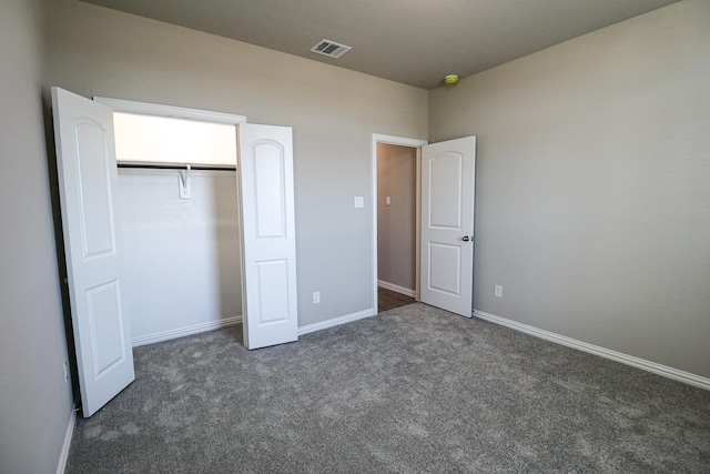 504 Lakeway Ln, Justin, TX 76247 - unfurnished bedroom featuring dark carpet, a closet, and baseboards