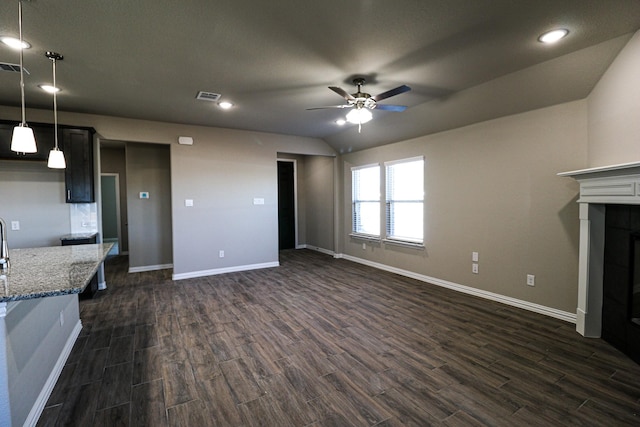 504 Lakeway Ln, Justin, TX 76247 - unfurnished living room featuring dark wood finished floors, a ceiling fan, baseboards, vaulted ceiling, and recessed lighting