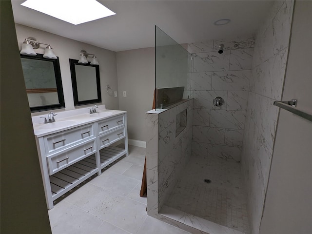 bathroom with a skylight, a walk in shower, and double vanity