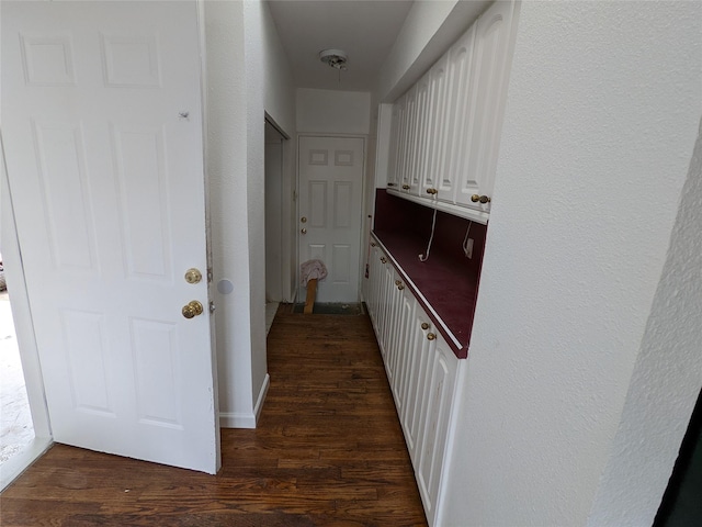 hall with dark wood-style floors