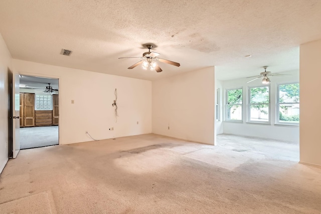 107 San Medina Ln, Joshua, TX 76058 - empty room featuring light carpet, ceiling fan, and a textured ceiling