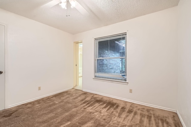 107 San Medina Ln, Joshua, TX 76058 - empty room with carpet, a textured ceiling, ceiling fan, and baseboards