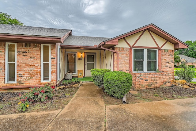 107 San Medina Ln, Joshua, TX 76058 - view of front of house featuring brick siding and a shingled roof