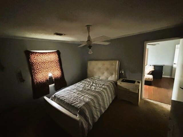 2220 N Clements St, Gainesville, TX 76240 - bedroom with ceiling fan, carpet flooring, and a textured ceiling