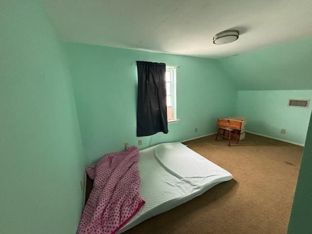 2220 N Clements St, Gainesville, TX 76240 - carpeted bedroom featuring lofted ceiling and baseboards