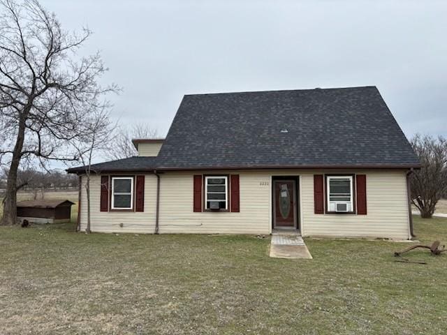 2220 N Clements St, Gainesville, TX 76240 - view of front of property with a front lawn and a shingled roof