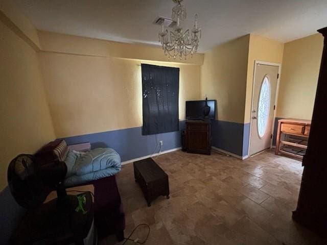 2220 N Clements St, Gainesville, TX 76240 - living area featuring a chandelier and baseboards