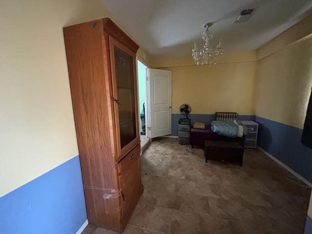 2220 N Clements St, Gainesville, TX 76240 - sitting room featuring a chandelier and baseboards