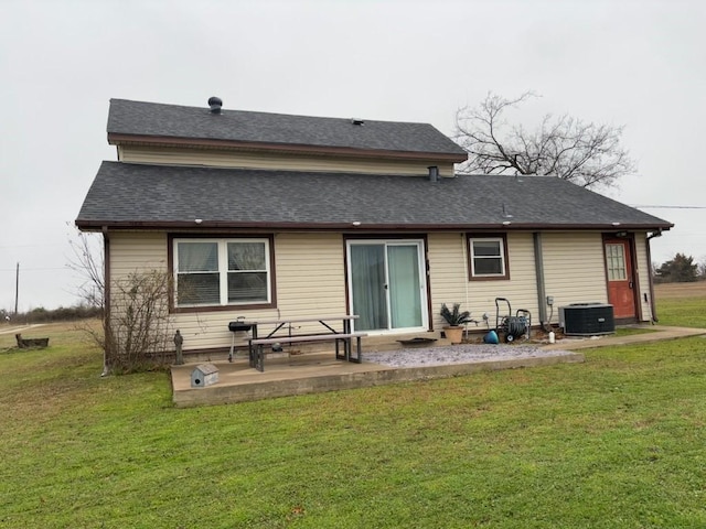 2220 N Clements St, Gainesville, TX 76240 - rear view of property with central air condition unit, a yard, a patio, and a shingled roof