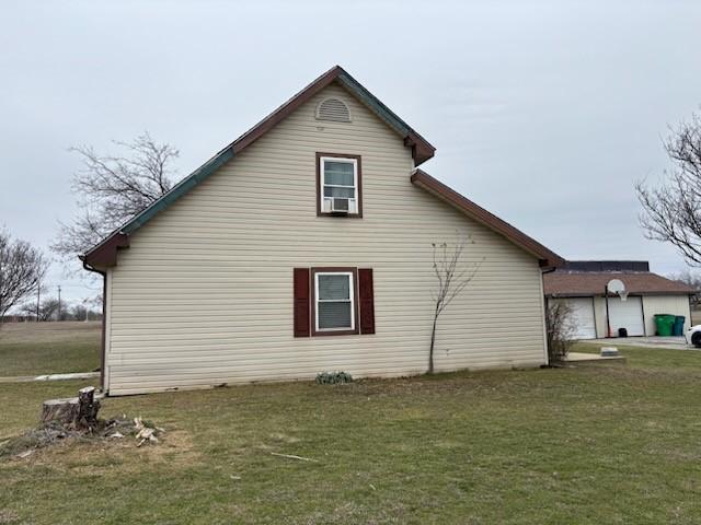 2220 N Clements St, Gainesville, TX 76240 - view of property exterior with a lawn and cooling unit