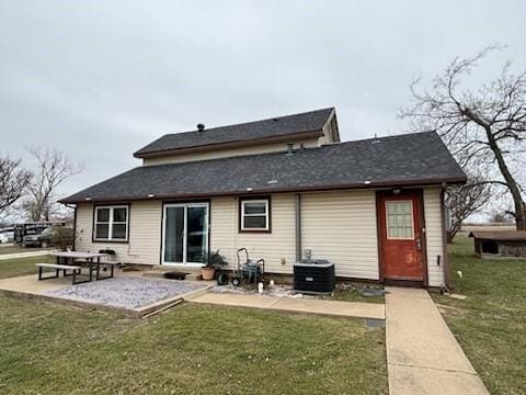 2220 N Clements St, Gainesville, TX 76240 - rear view of house with a patio, a yard, and cooling unit