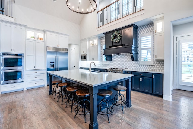 5208 Westfield Dr, Parker, TX 75002 - kitchen featuring built in appliances, high vaulted ceiling, light countertops, backsplash, and a sink