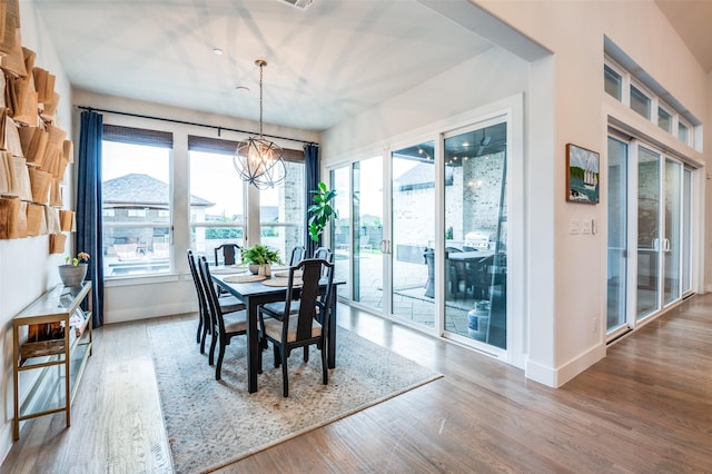 5208 Westfield Dr, Parker, TX 75002 - dining room featuring wood finished floors, baseboards, and a chandelier