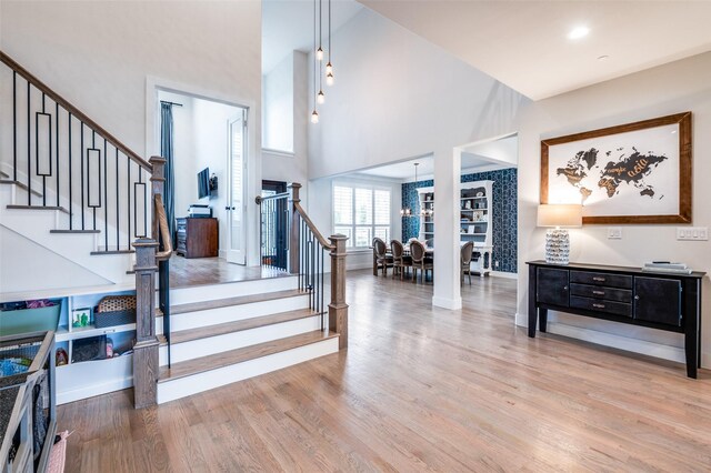5208 Westfield Dr, Parker, TX 75002 - staircase with a towering ceiling, wood finished floors, and baseboards