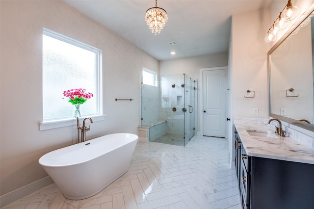 5208 Westfield Dr, Parker, TX 75002 - full bath with vanity, a chandelier, a stall shower, a freestanding tub, and baseboards