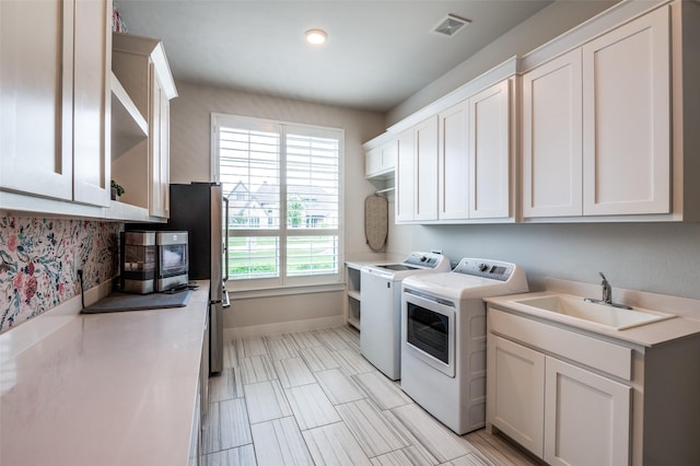 5208 Westfield Dr, Parker, TX 75002 - laundry area with independent washer and dryer, cabinet space, and baseboards