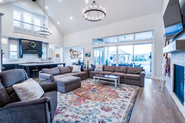 5208 Westfield Dr, Parker, TX 75002 - living room with a chandelier, high vaulted ceiling, light wood-style floors, healthy amount of natural light, and recessed lighting