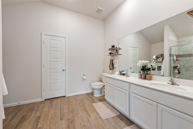 148 Greenback Trl, Fort Worth, TX 76131 - full bath featuring vaulted ceiling, a stall shower, toilet, double vanity, and wood finished floors