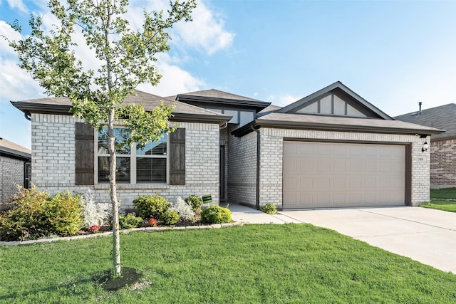 148 Greenback Trl, Fort Worth, TX 76131 - view of front of home with concrete driveway, brick siding, a front yard, a garage, and roof with shingles