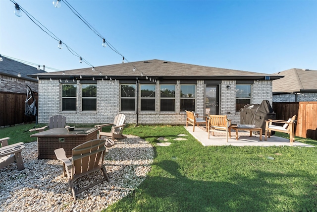 148 Greenback Trl, Fort Worth, TX 76131 - back of property with a patio area, brick siding, and a shingled roof