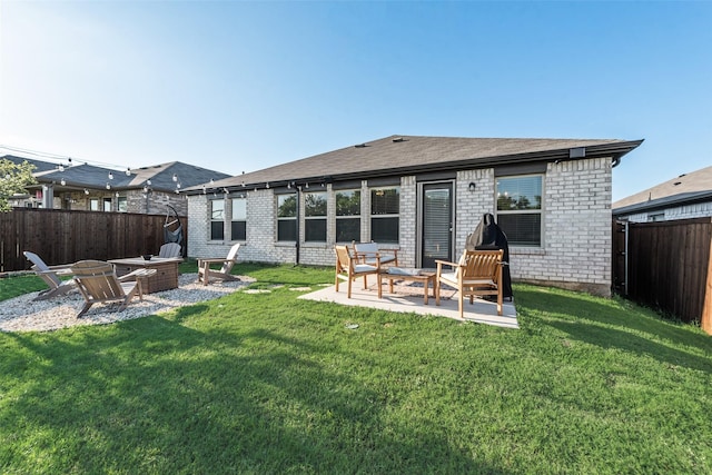 148 Greenback Trl, Fort Worth, TX 76131 - rear view of property featuring a fire pit, a patio, and brick siding