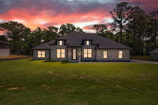 14541 Woodland Crk, Tyler, TX 75706 - view of front of home featuring a yard, roof with shingles, and stucco siding