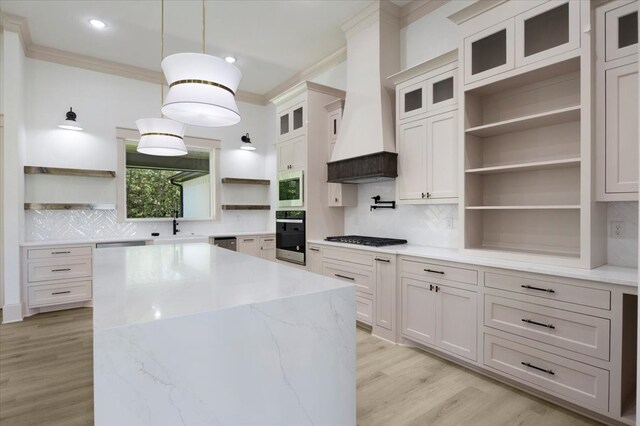 14541 Woodland Crk, Tyler, TX 75706 - kitchen with open shelves, oven, crown molding, white microwave, and gas stovetop