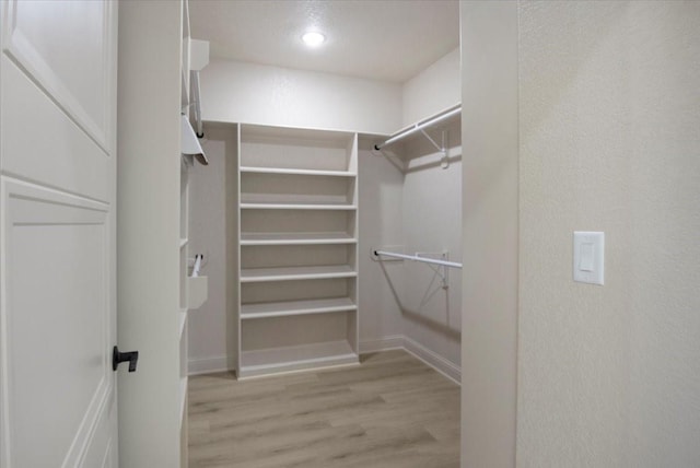 14541 Woodland Crk, Tyler, TX 75706 - walk in closet with light wood-type flooring