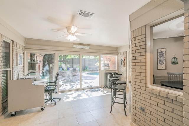 2314 Wakeforest Ct, Arlington, TX 76012 - sunroom with a ceiling fan, tile patterned flooring, and brick wall