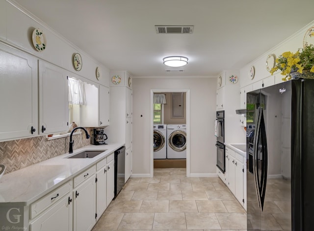 451 Burney St, Coushatta, LA 71019 - clothes washing area featuring washer and dryer, ornamental molding, electric panel, and baseboards