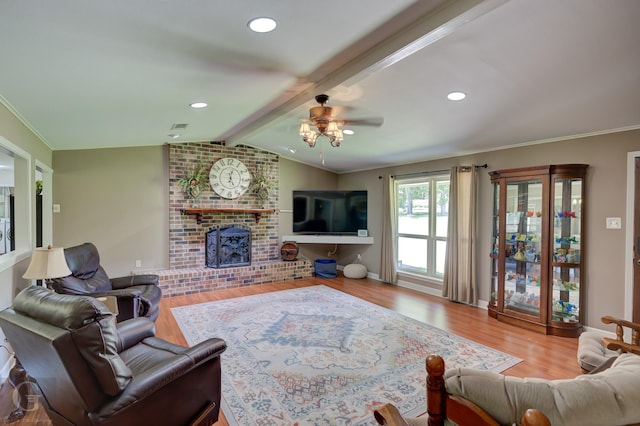 451 Burney St, Coushatta, LA 71019 - living room with wood finished floors, ceiling fan, a fireplace, ornamental molding, and baseboards