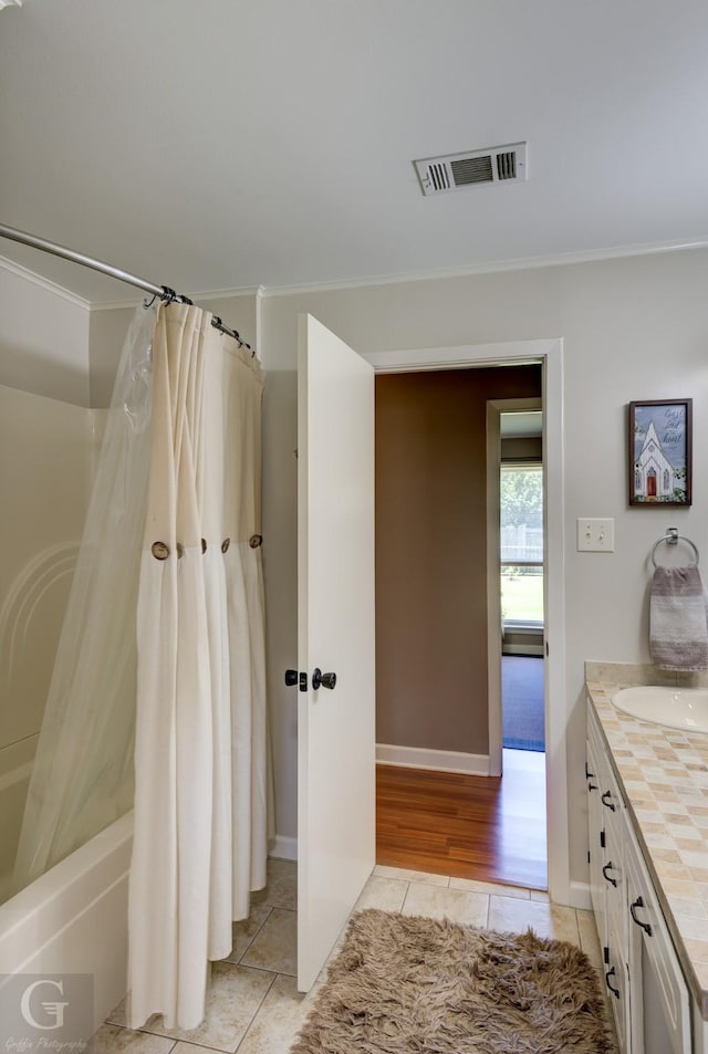 451 Burney St, Coushatta, LA 71019 - bathroom with tile patterned floors, ornamental molding, vanity, shower / tub combo, and baseboards