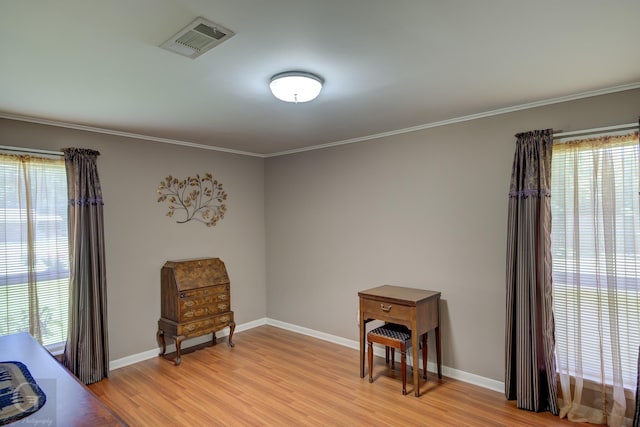 451 Burney St, Coushatta, LA 71019 - living area featuring healthy amount of natural light, light wood-style floors, baseboards, and ornamental molding