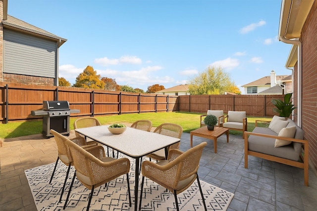 1315 Falcon Dr, Lewisville, TX 75077 - view of patio featuring a grill, outdoor lounge area, and outdoor dining space