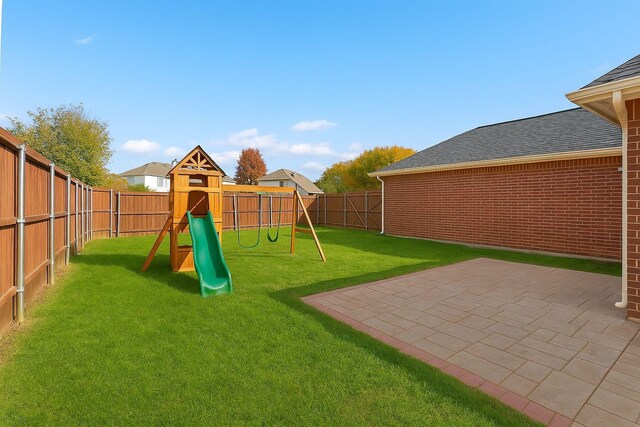 1315 Falcon Dr, Lewisville, TX 75077 - view of yard featuring a playground and a patio